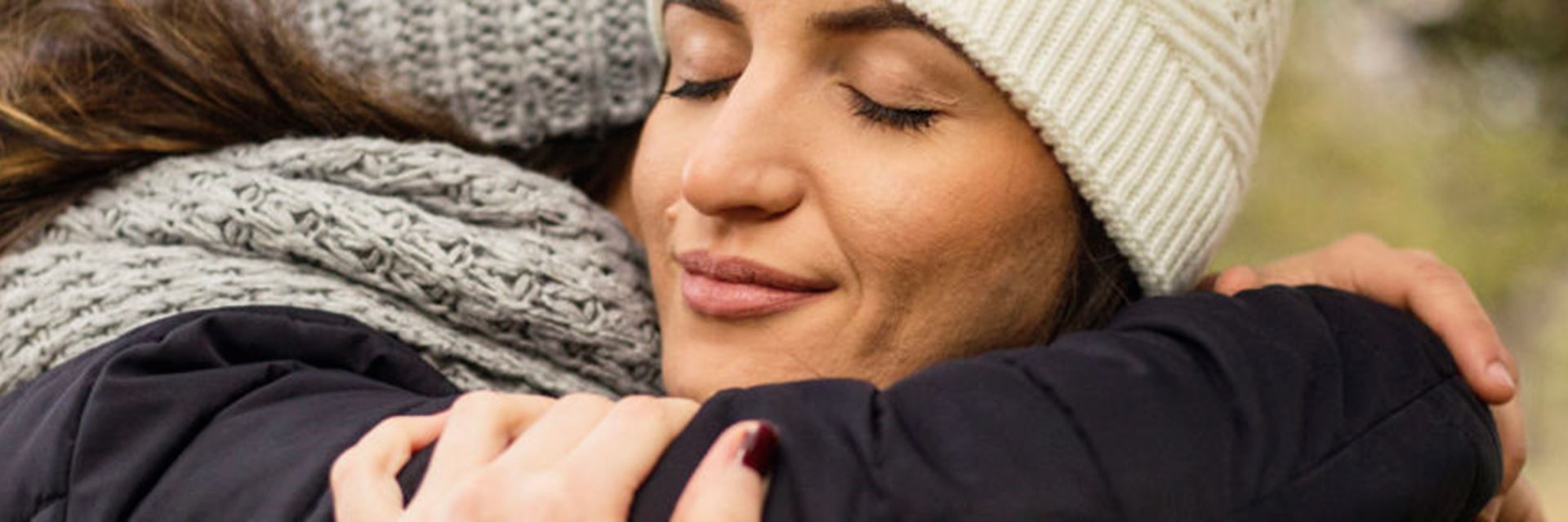 A support worker hugging a foster mother