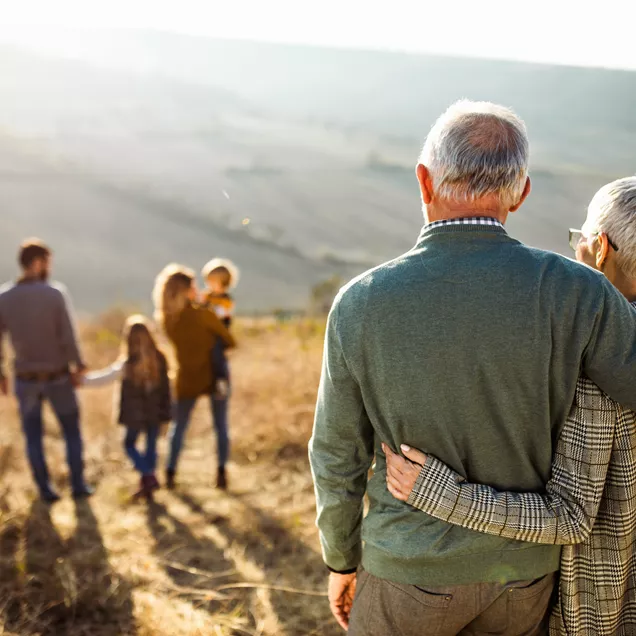 extended family with grandparents, parents and foster children enjoying the local countryside